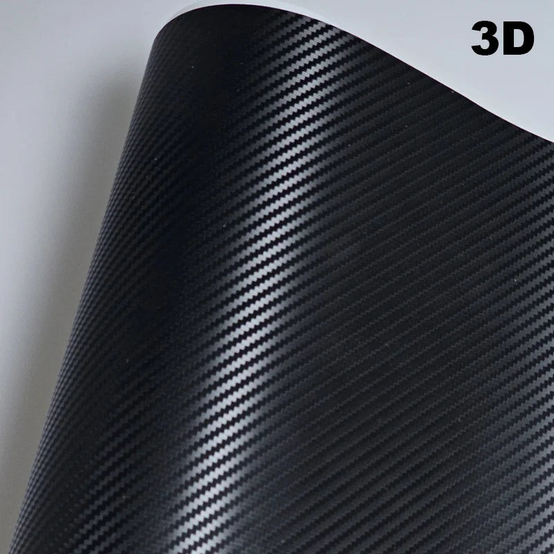 Roll of black carbon fiber vinyl wrap with '3D' text on a white background
