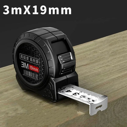 Black tape measure with '3M 19mm' label on a wooden surface