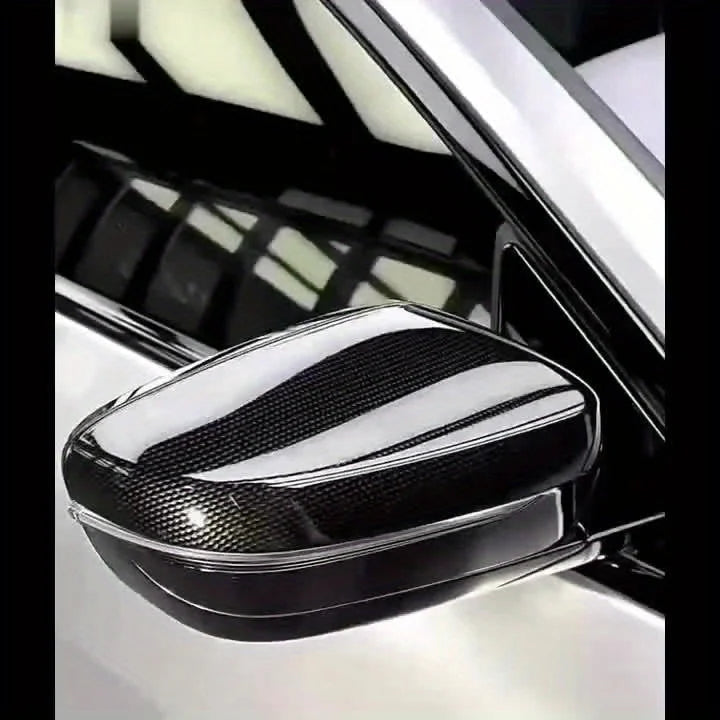 Car side mirror with carbon fiber texture on a vehicle