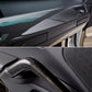 Carbon fiber interior car panel and handle with a detailed texture.