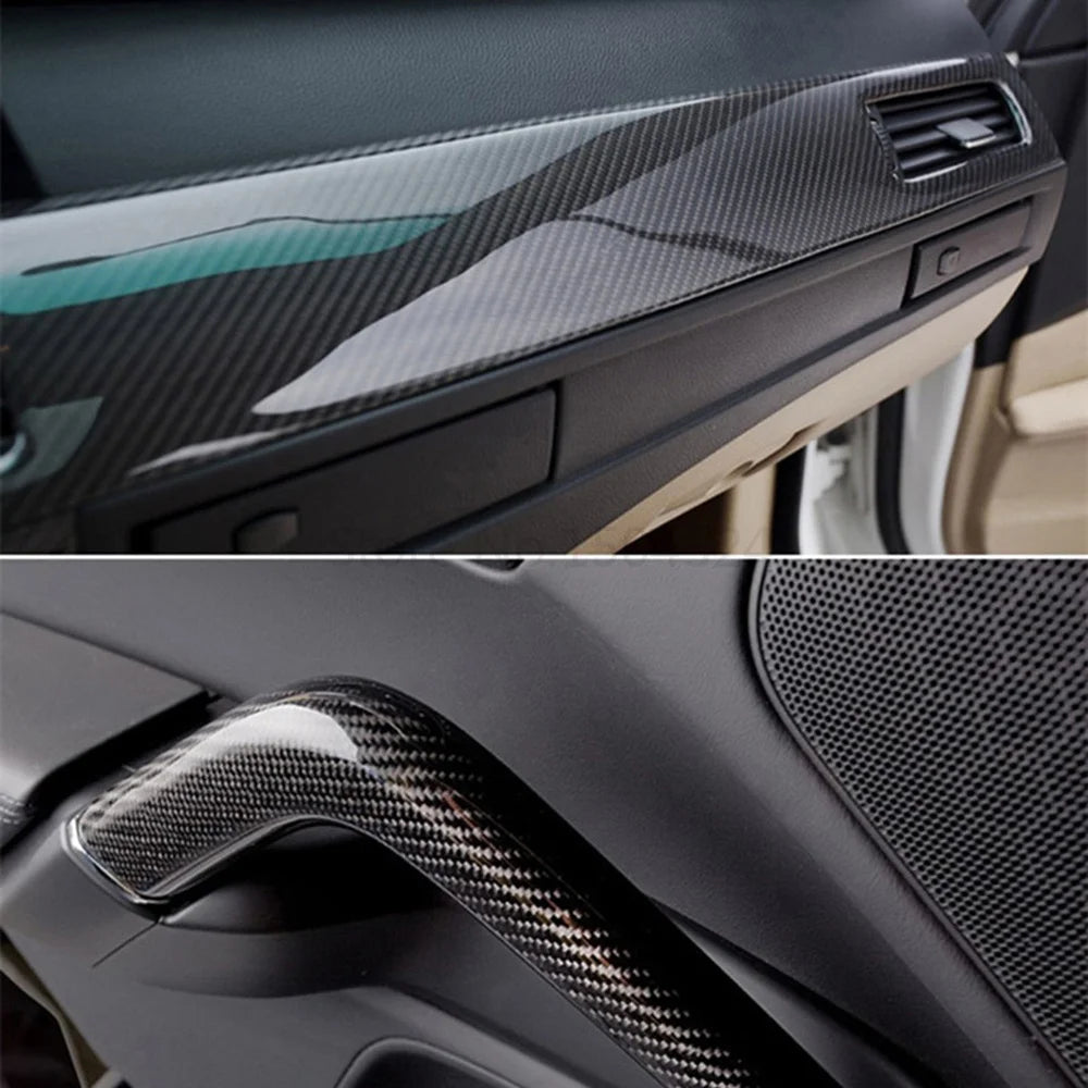 Carbon fiber interior car panel and handle with a detailed texture.