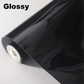 Roll of glossy black vinyl wrap on a white background with 'Glossy' text.