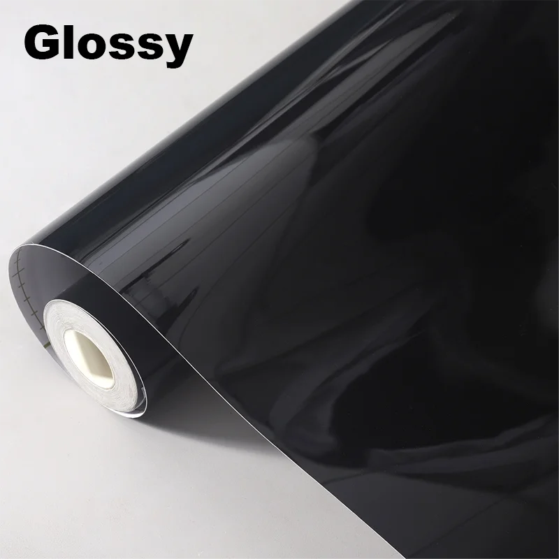 Roll of glossy black vinyl wrap on a white background with 'Glossy' text.