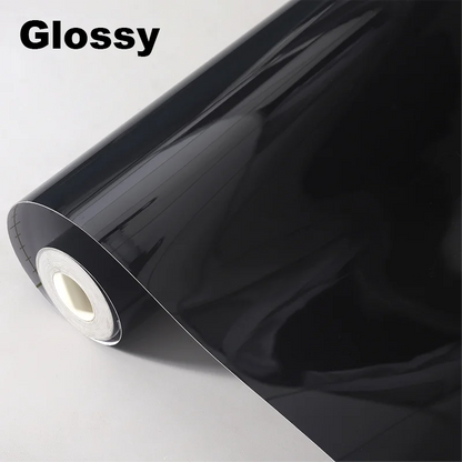 Roll of glossy black vinyl wrap on a white background with 'Glossy' text.